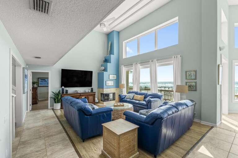 Beachside Living Room With Blue Sofas And Bright Windows