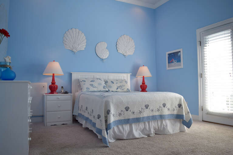 The master bedroom on the upper level has 1 queen bed, TV, private bath and private balcony.