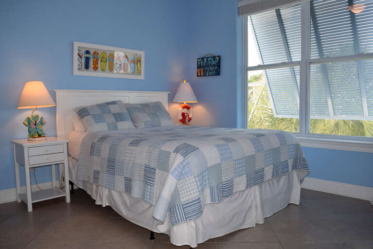 Bedroom 3 is located on the main level and has 1 queen bed and private bath.