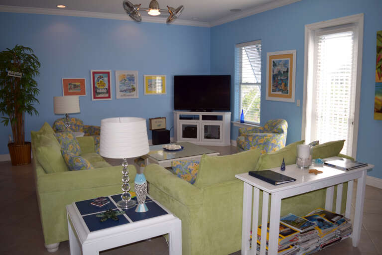 Another view of the living area with access to the back stairs.