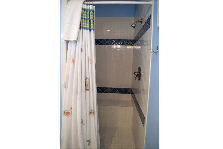 The master bath has a stand up shower.