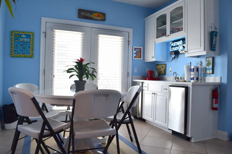 A kitchenette and small dining table is located on the upper level.