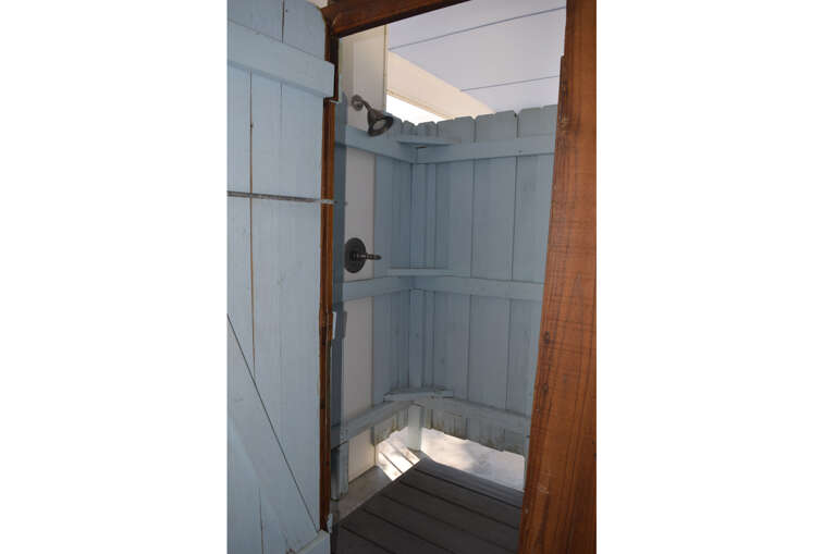 An outdoor shower is available for rinsing off after swimming or a day at the beach.