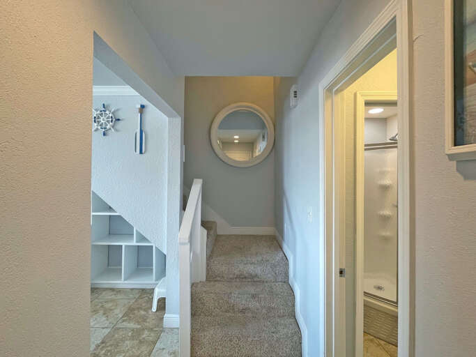 Interior Hallway With Mirror And Staircase