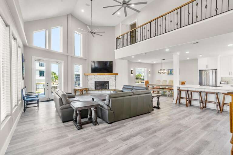 Interior Of A Spacious Living Room With Kitchen Area And High Ceiling Interior Of A Spacious Living Room With Kitchen Area And High Ceiling