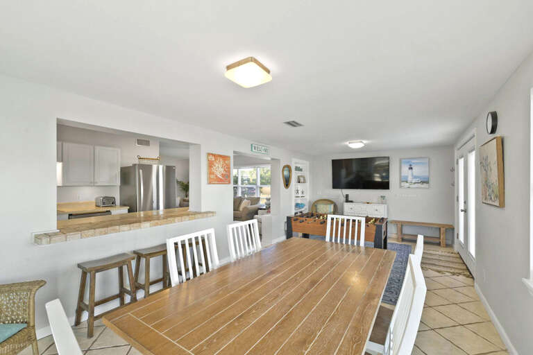Interior Dining Area With Table And Adjacent Living Room Space