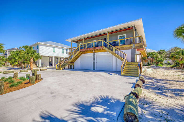 Elevated Beach House With Staircase And Garage