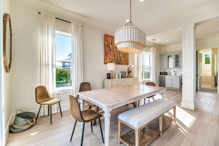 Brightly Lit Dining Space With Sleek Seating And Spotless Surfaces