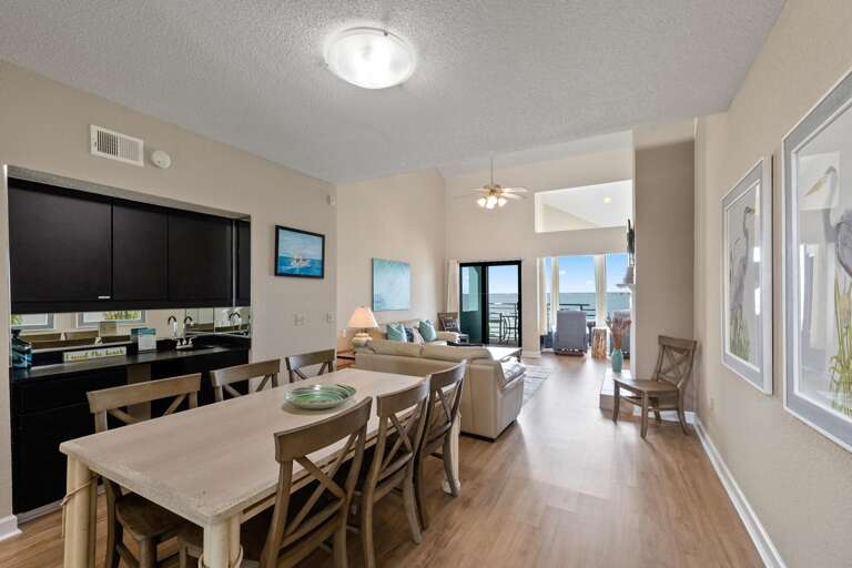 Interior Showing Spacious Living Area With Linked Dining Space And Visible Balcony