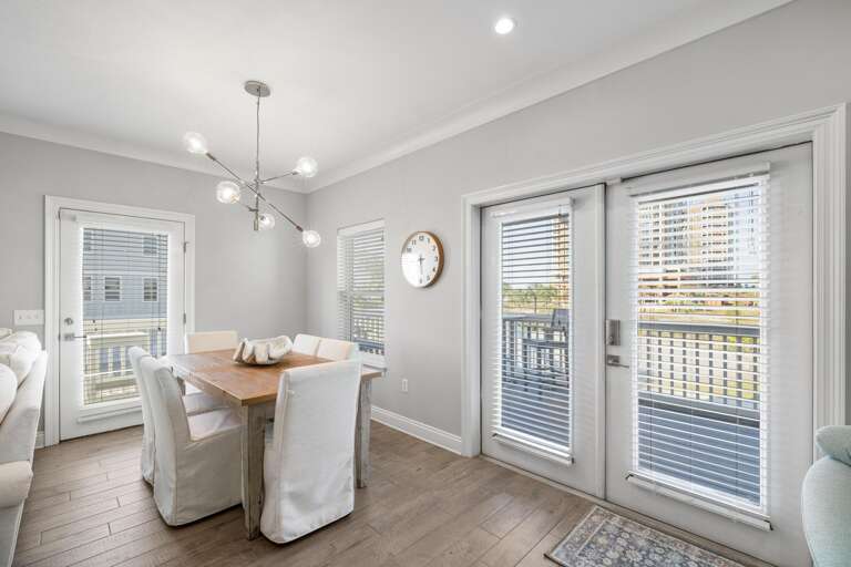 Light-filled Living Room Leading To Balcony In Vacation Rental