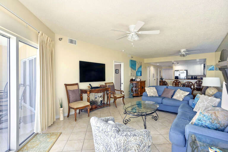 Bright Living Room With Blue Sofas And Sliding Glass Door Bright Living Room With Blue Sofas And Sliding Glass Door