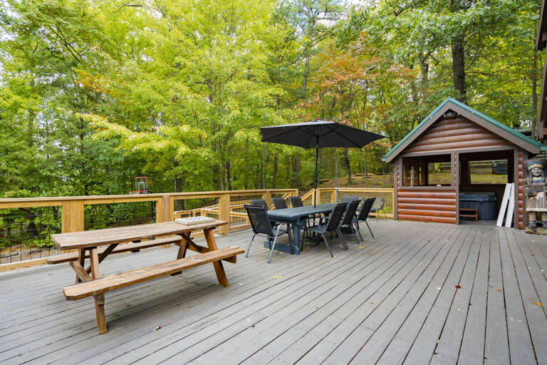 Deck Dining Area Surrounded By Trees