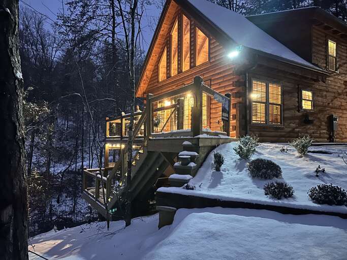 Snowy Scene, Cabin Glowing Gently At Dusk