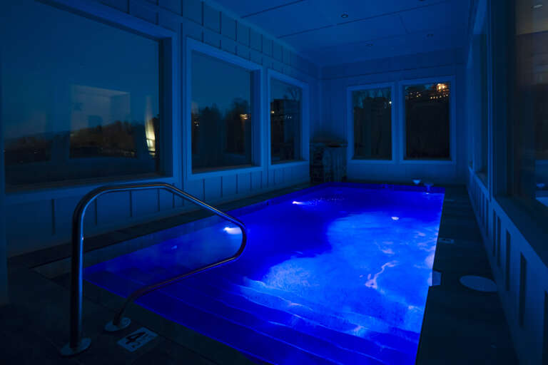 Blue-lit Indoor Pool With Nighttime Ambiance