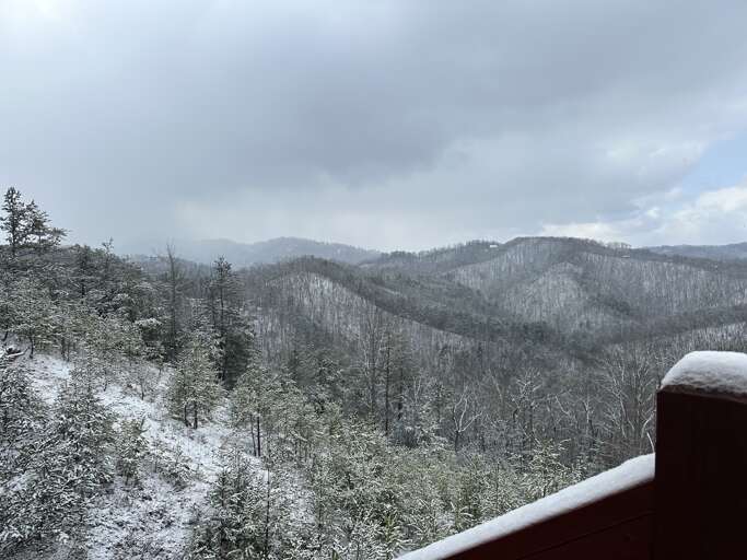 Snow-dusted Mountain View From Vacation Rental Balcony