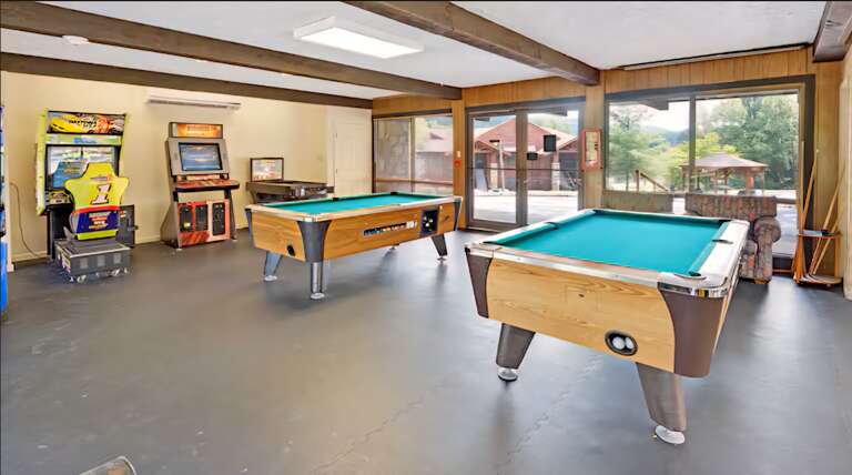 Game Room With Pool Tables And Arcade Games In Vacation Rental
