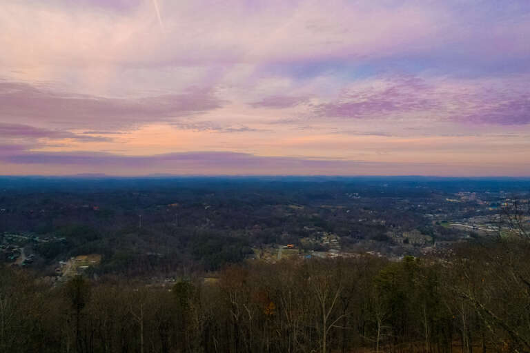 Aerial View Of Vibrant Sunset Over Vast Valley