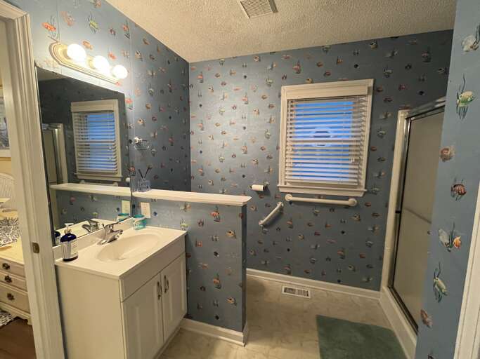 bathroom 1 open to bedroom 1 and hall
