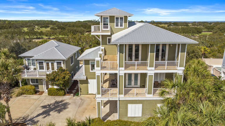 Aerial View Of Spacious Green Vacation Rental Amidst Serene Scenery