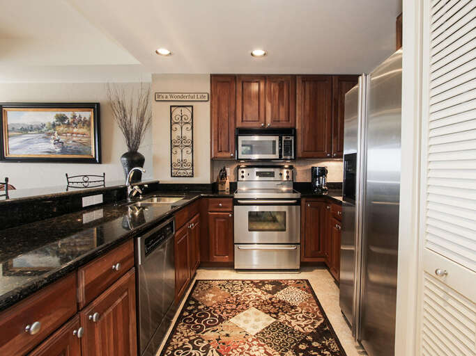 Polished Kitchen, Stainless Steel Appliances, Sleek Surfaces