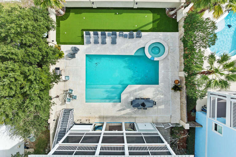 Aerial View Of Blue Pool By Lush Lawn