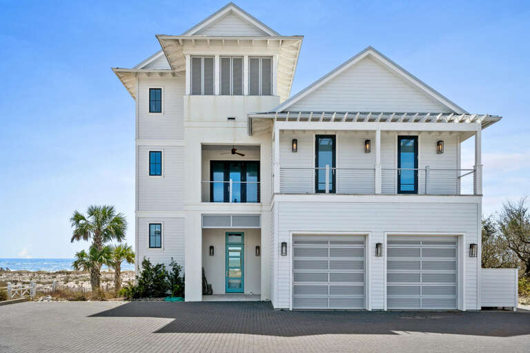 White Waterfront Residence With Blue Balcony, Towering Three Tiers, Twin Garages