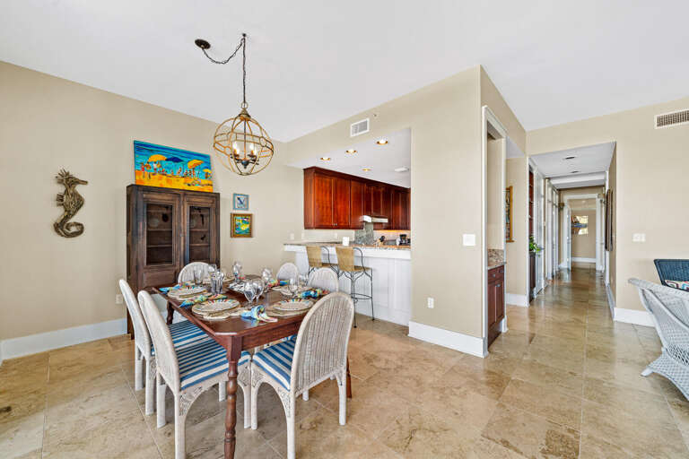 Spacious Dining Area Leading To Kitchen Inside Vacation Rental