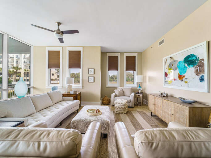 Spacious Living Room With Plush Sofas And Vivid Wall Art, Panoramic Windows
