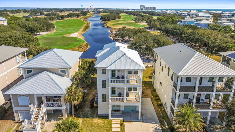 Aerial View Of Lakeside Residential Buildings Near Golf Course