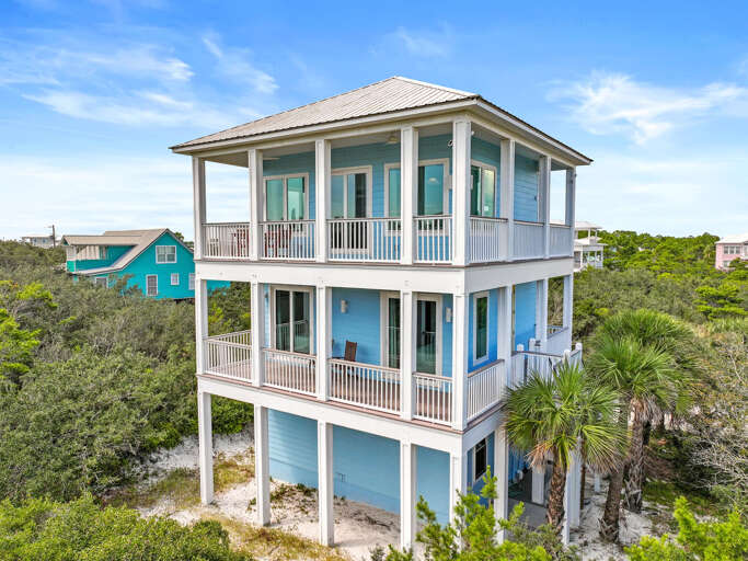 Blue Beachside Vacation Rental Nestled In Nature