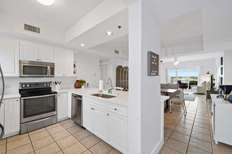 Bright, Spacious Kitchen Leading Into Living Area In Vacation Rental
