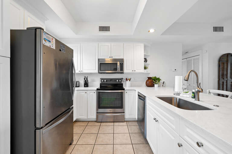 Bright, White Kitchen With Stainless Steel Appliances