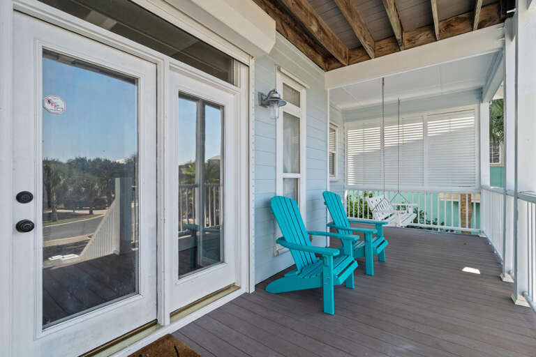 Blue Chairs On Balcony Beside Bright Blinds