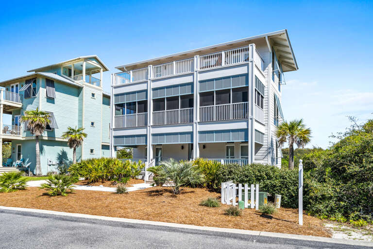 Multistory Blue Building Beside Sunlit Street
