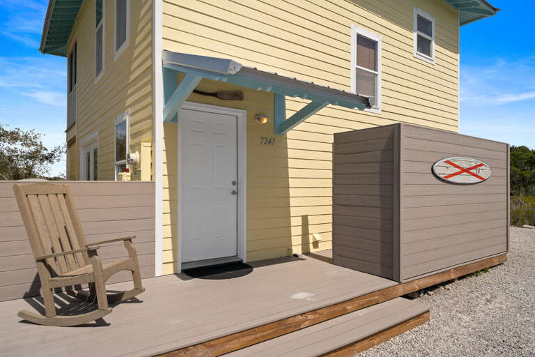 Yellow Building Beside Bench, Bright Blue Sky Backdrop