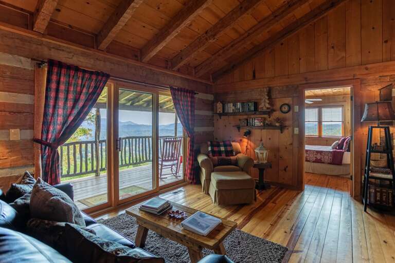 Rustic Cabin Interior With Lake View From Balcony