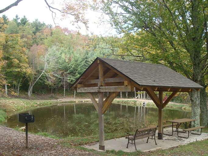 Community park with covered benches and outdoor grill