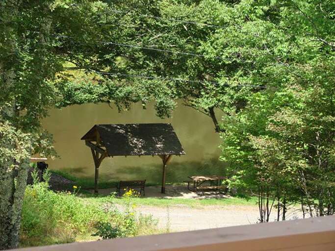 Community park with pond and covered benches