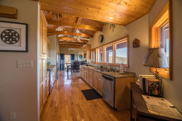 Well-stocked kitchen with stainless steel appliances and granite counters
