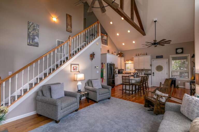 Interior Of A Residential Living Space With Staircase And Kitchen