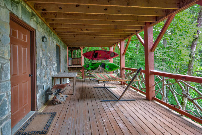 Covered deck with hammock and kayaks