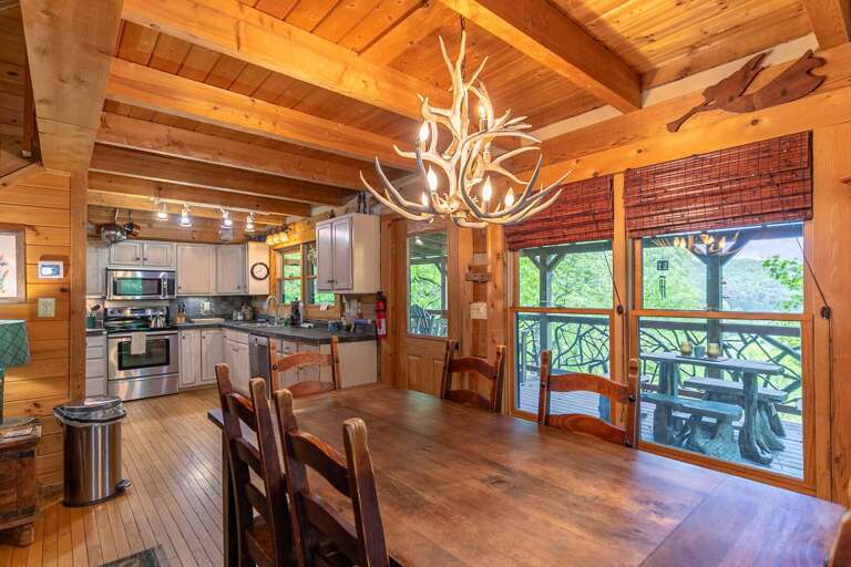 Rustic Vacation Rental Interior With Kitchen And Antler Chandelier Rustic Vacation Rental Interior With Kitchen And Antler Chandelier