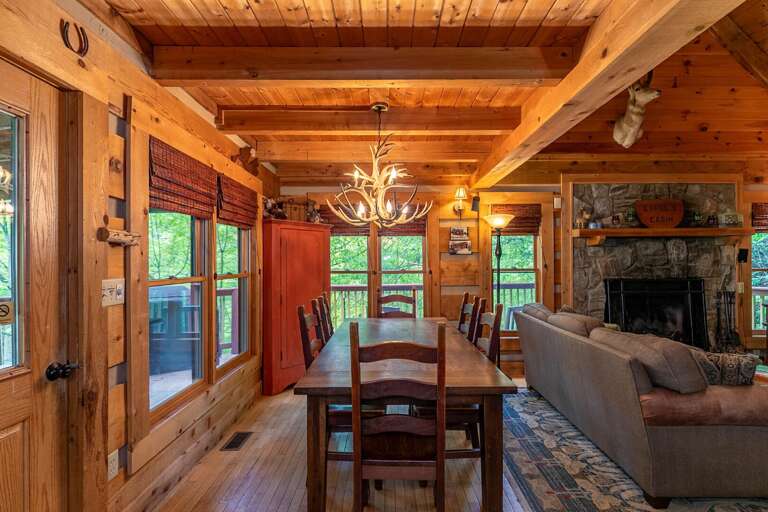 Rustic Cabin Interior With Dining Area And Fireplace