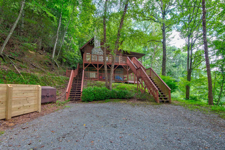 Tucked into the trees at St Johns Ridge, the cabin's elevated decks and wood staircases set the mood before you even step inside.