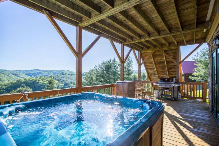 Hot tub and gas grill on the outside deck Hot tub and gas grill on the outside deck