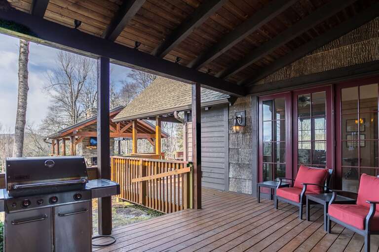 Covered deck with outdoor seating and grill Covered deck with outdoor seating and grill