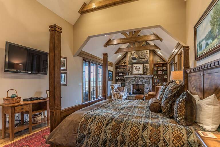 Main level king bedroom with fireplace Main level king bedroom with fireplace