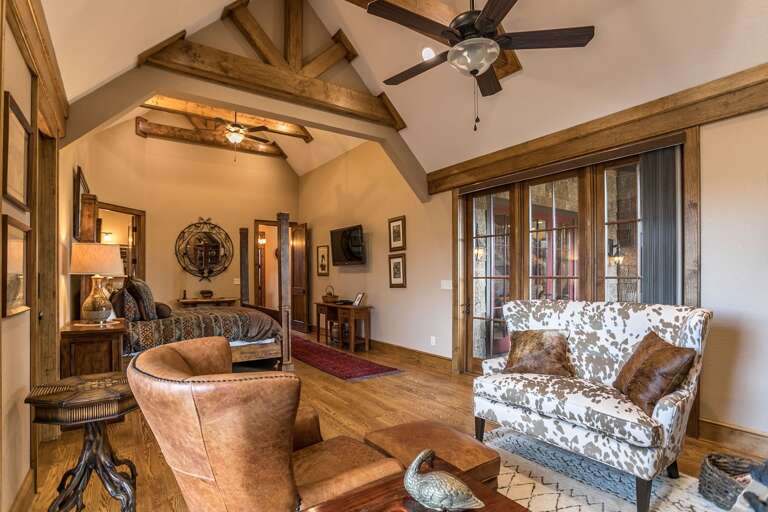 Main level king bedroom with fireplace