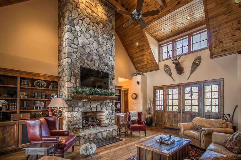 Open living room area with TV and fireplace Open living room area with TV and fireplace