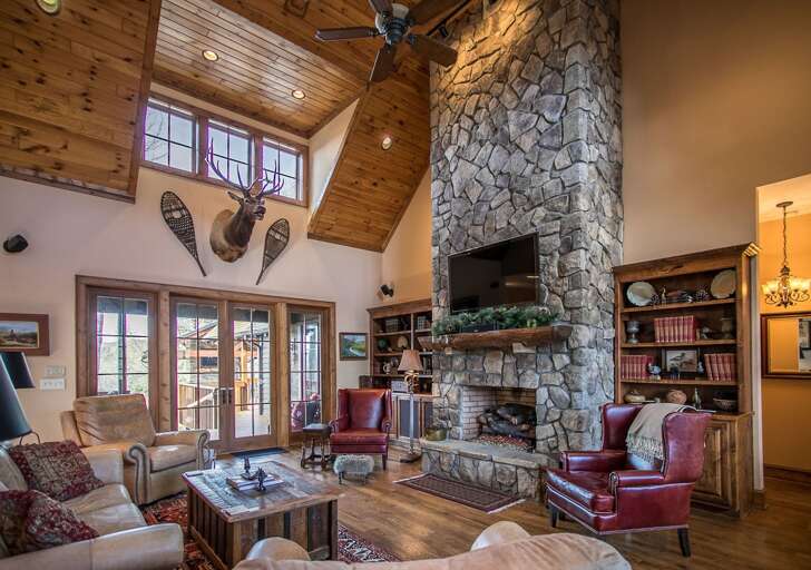 Open living room area with TV and fireplace Open living room area with TV and fireplace